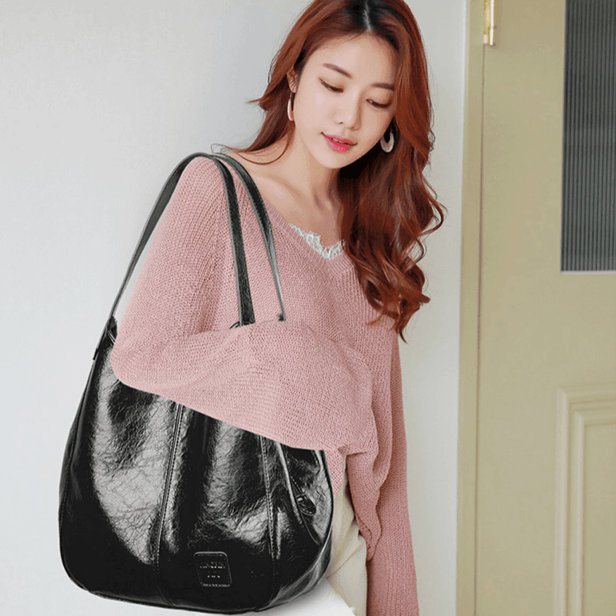 תיק קל לנשיאה על הכתף בחלוקה פרקטית נבונה של תאים ללוק נשי חריף - לה איסלה