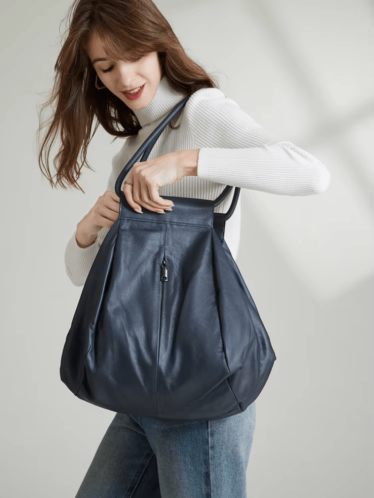 תיק עור בעיצוב חדשני להופעה מגוונת ומדליקה ללוק של אישה אופנתית חזקה