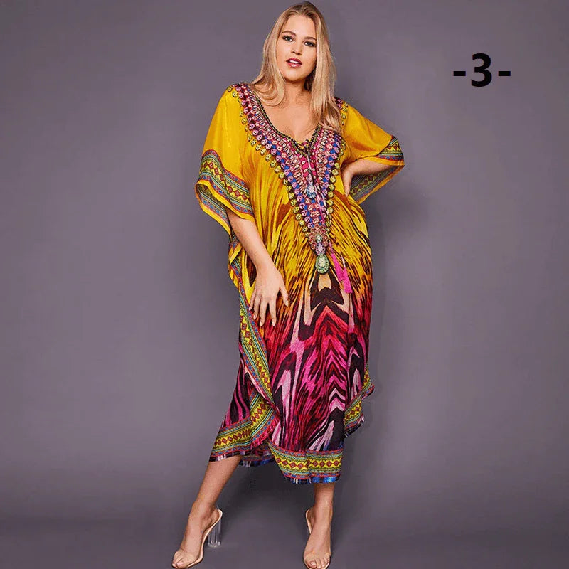 שמלת קיץ קלילה שמתאימה גם לחוף בגיזרת אוברסייז בהדפסים צבעוניים ללוק מטריף - לה איסלה