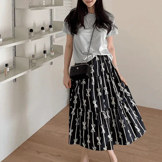 חצאית נשית בגיזרת מקסי רחבה בשילובבדפס פפיון מרהיב להופעה נשית יוקרתית - לה איסלה