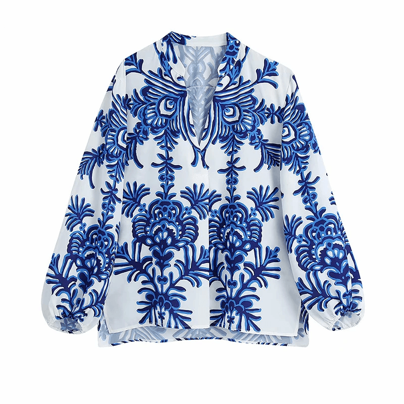 חולצת מעצב בגיזרת שרוולים תפוחים בהדפס כחול לבן פרחוני ללוק נשי מיוחד - לה איסלה 