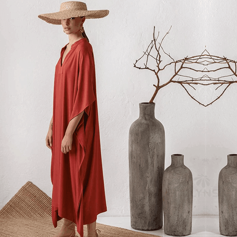 שמלת אוברסייז אסימטרית של מעצב בגיזרה נשית מתנופפת ללוק טרנדי נכון - לה איסלה