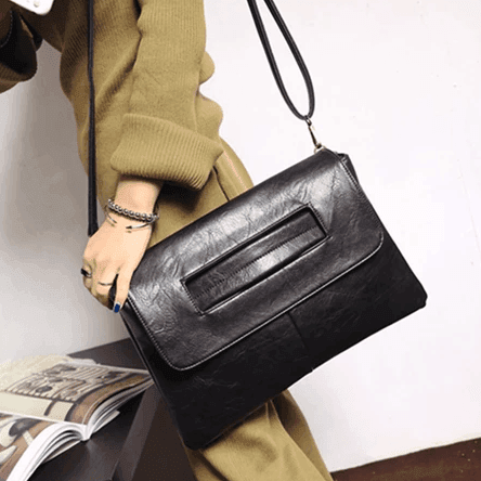 קלאץ שנתפס על היד בגיזרת תיק שהוא גם ארנק קליל ופרקטי ללוק נשי ייצוגי - לה איסלה