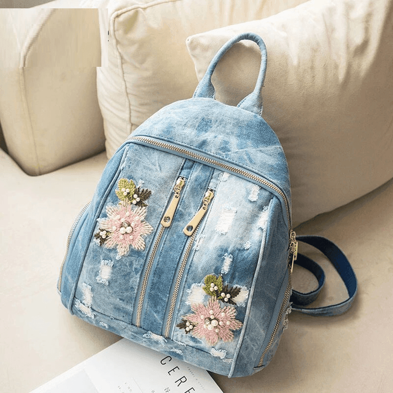 תיק מעצב מג'ינס מקורי בגיזרה קלילה ונשית בשילוב טלאי פרחים וחרוזי פנינה - לה איסלה