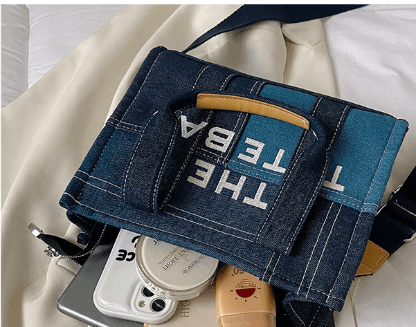 תיק ג'ינס מושלם לנשיאה ביד או על הכתף ללוק טרנדי ולהופעה של אישה שמבינה באופנה - לה איסלה