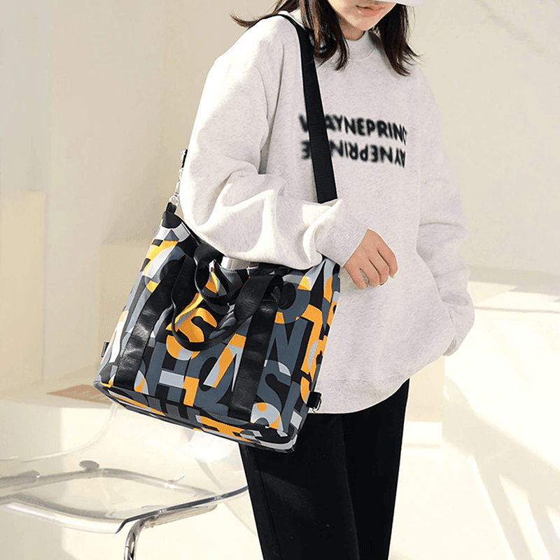 תיק מושלם ליום יום של מעצב אמריקאי בגימור אותיות צבעוני ללוק נשי אופנתי - לה איסלה