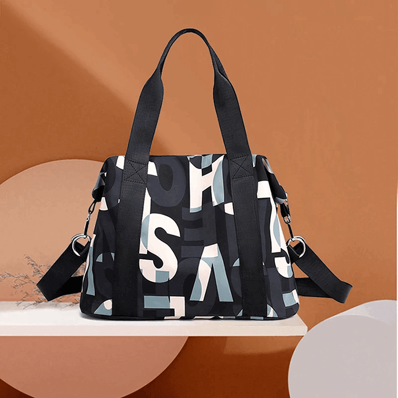 תיק מושלם ליום יום של מעצב אמריקאי בגימור אותיות צבעוני ללוק נשי אופנתי - לה איסלה