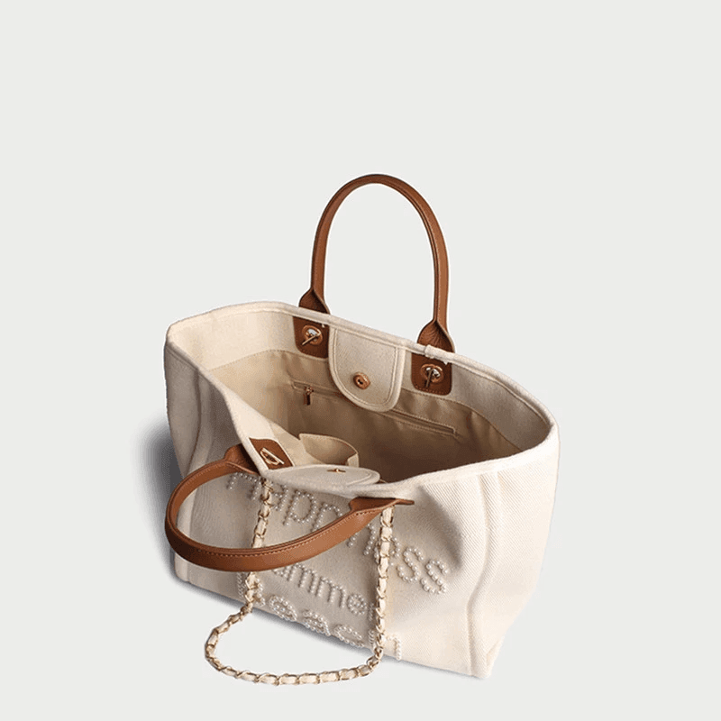 תיק בד של מותג ספרדי בשילוב חרוזי פנינה ובעיצוב מרשים להופעה נשית קלילה וטרנדית - לה איסלה