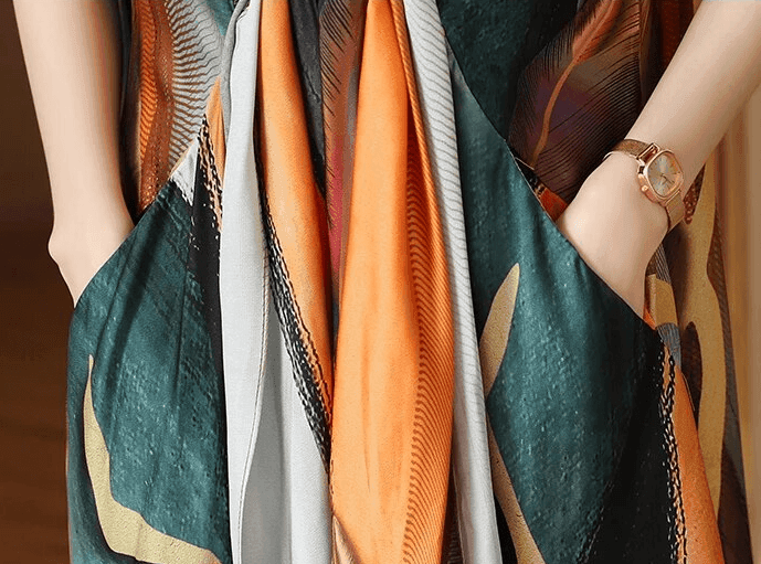 שמלת מעצב בגיזרה אסימטרית של מעצב בגימור כיסים משגע ובצבעוניות מרהיבה - לה איסלה