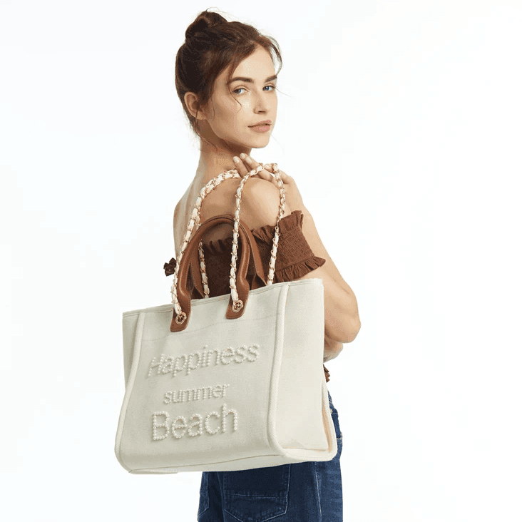 תיק בד של מותג ספרדי בשילוב חרוזי פנינה ובעיצוב מרשים להופעה נשית קלילה וטרנדית - לה איסלה