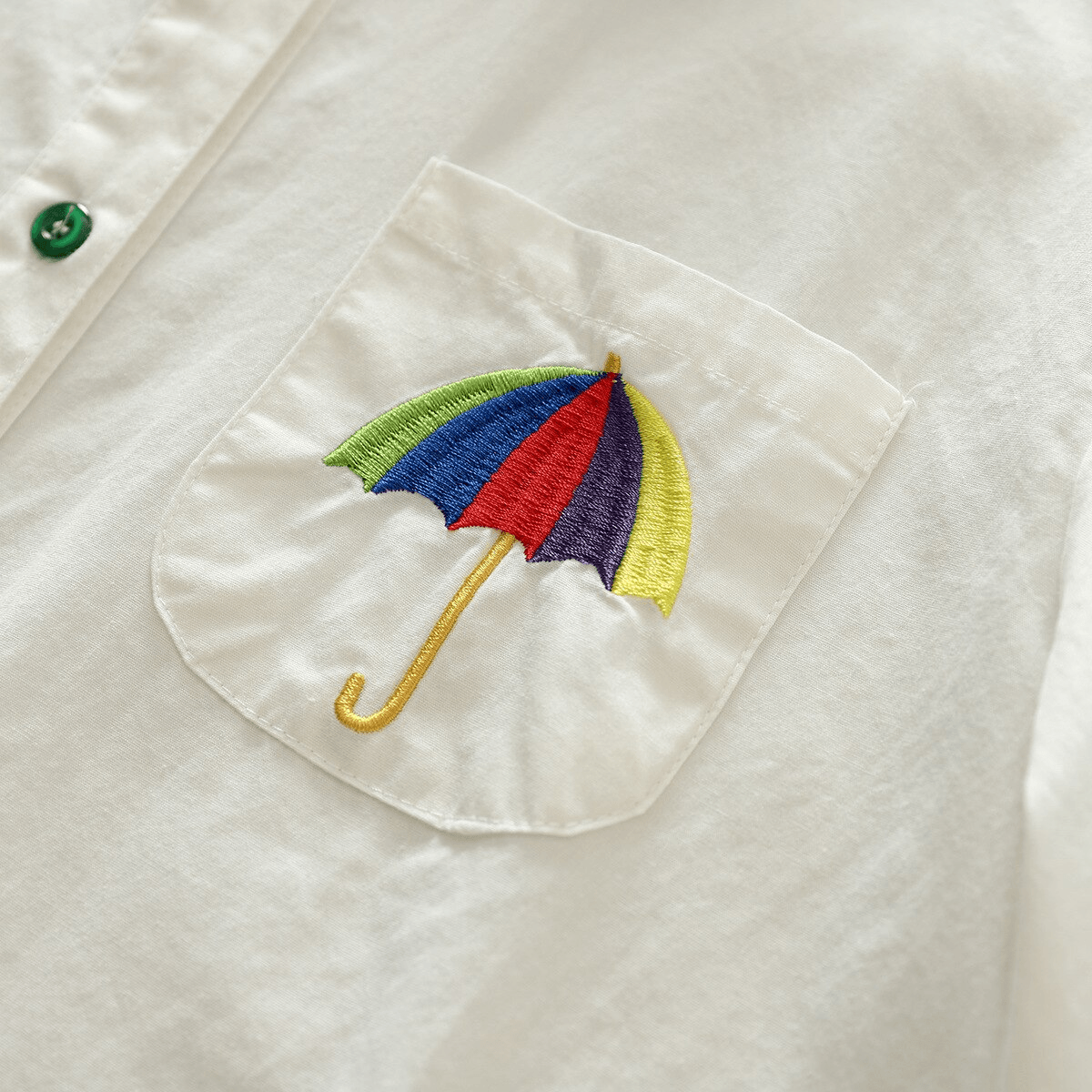 מכופרת חגיגית בגימור כפתורים צבעוניים ובשילוב ריקמת מטריה ללוק שיקי מושקע - לה איסלה 